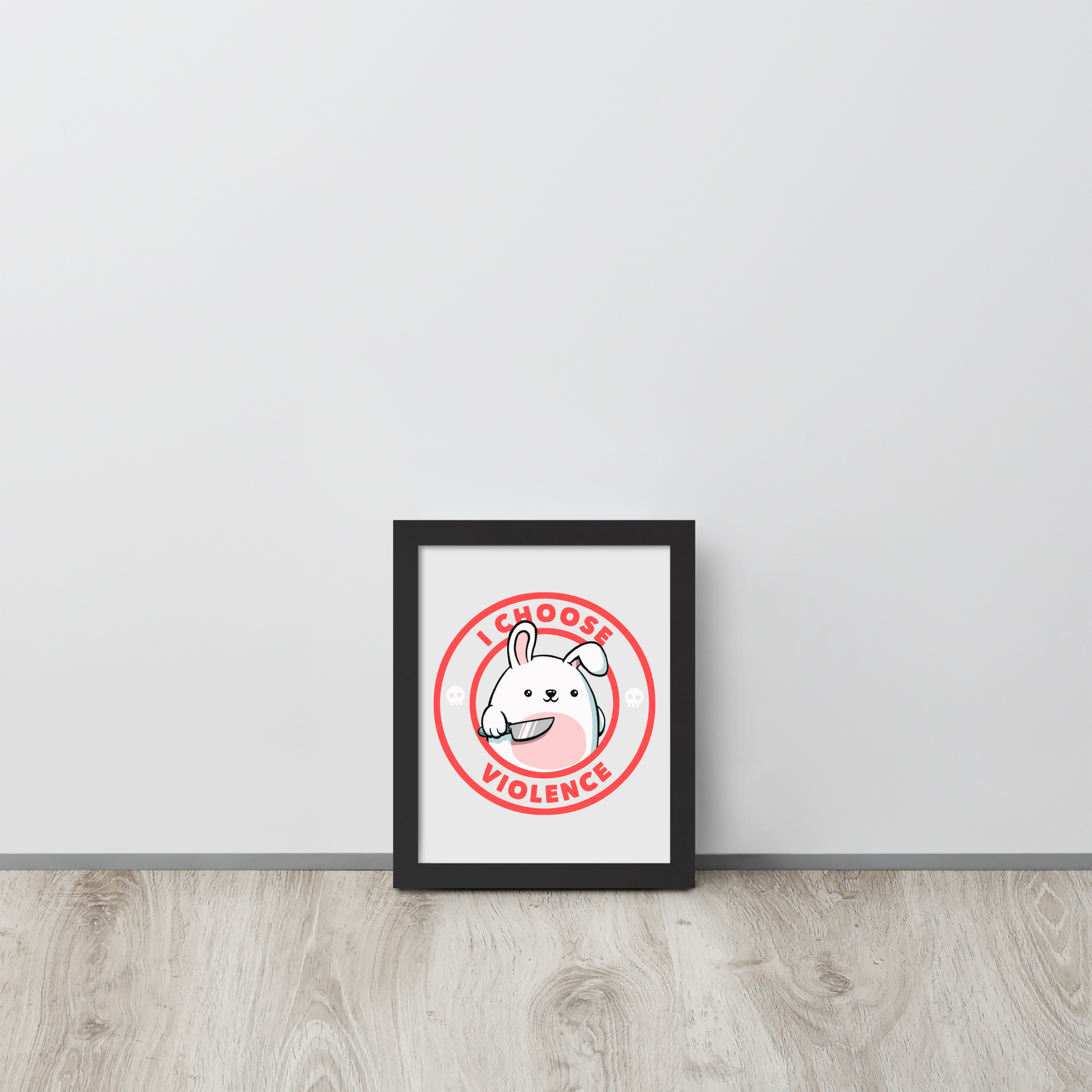 A cute white cartoon bunny with a pink belly stands holding a large kitchen knife in one paw. Surrounding the bunny is a red circular border with the words 'I CHOOSE VIOLENCE'. Small skull icons are on either side of the circle. The overall tone is a mix of adorable and ironic humor.