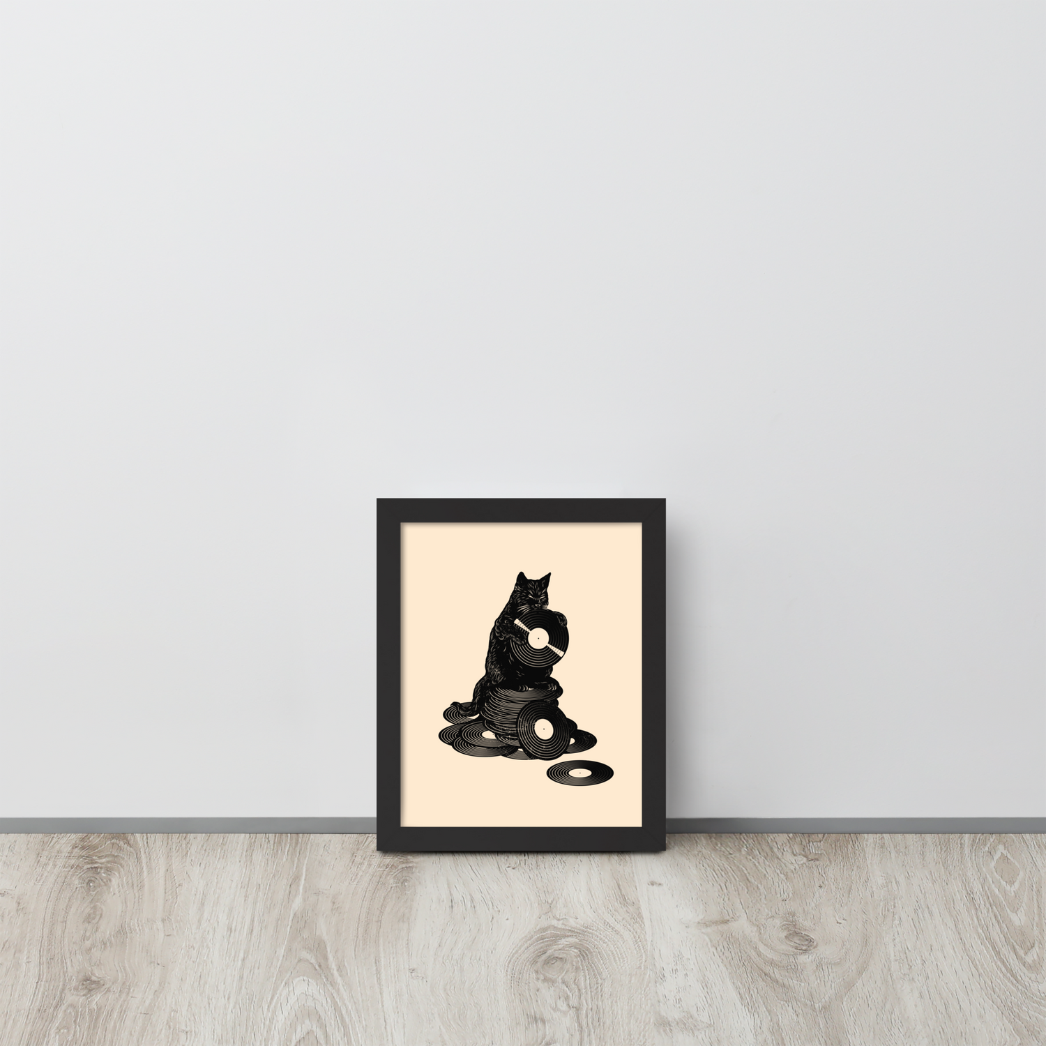 This design features a black cat cozily perched atop a stack of vinyl records, clutching one like it’s pure gold. It’s a tribute to analog lovers, feline charm, and the timeless joy of spinning a record. Perfect for music collectors, cat enthusiasts, and anyone with a nostalgic soul.