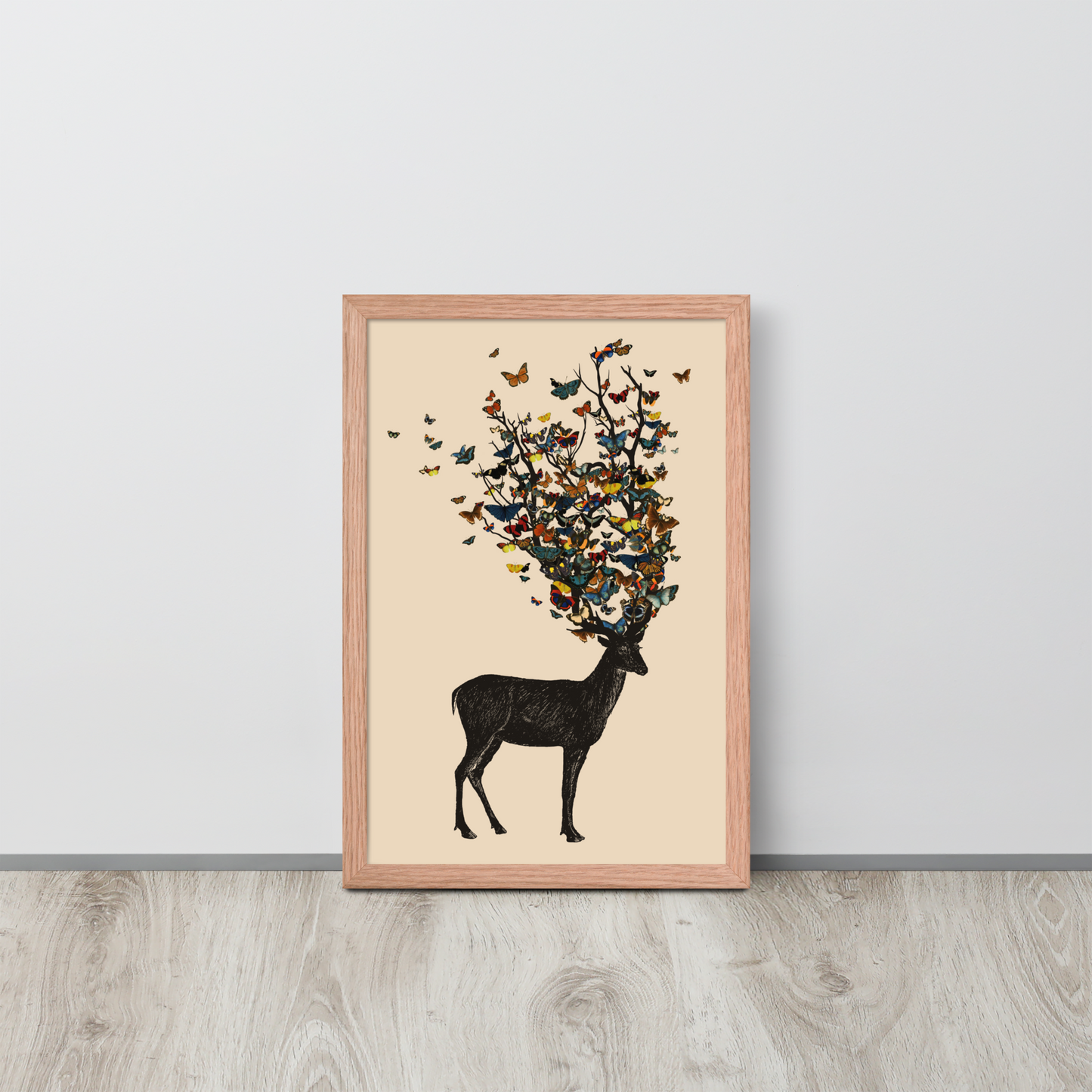 The image depicts a dark, silhouetted deer standing on a neutral background. Instead of branches, its antlers transform into a swirling cloud of vibrant, colorful butterflies that extend upwards and outward. The mix of organic and ethereal elements creates a captivating and whimsical visual contrast.