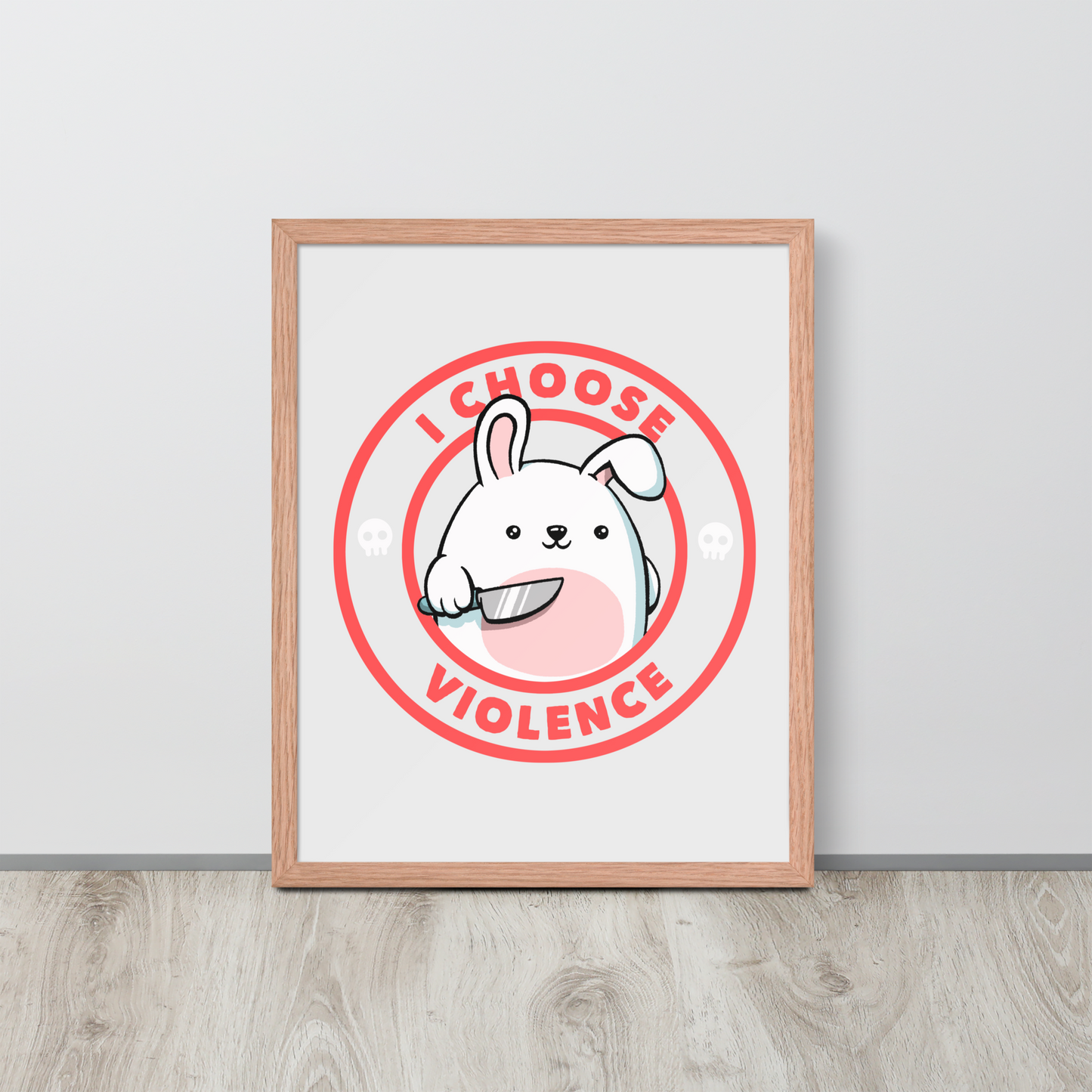A cute white cartoon bunny with a pink belly stands holding a large kitchen knife in one paw. Surrounding the bunny is a red circular border with the words 'I CHOOSE VIOLENCE'. Small skull icons are on either side of the circle. The overall tone is a mix of adorable and ironic humor.