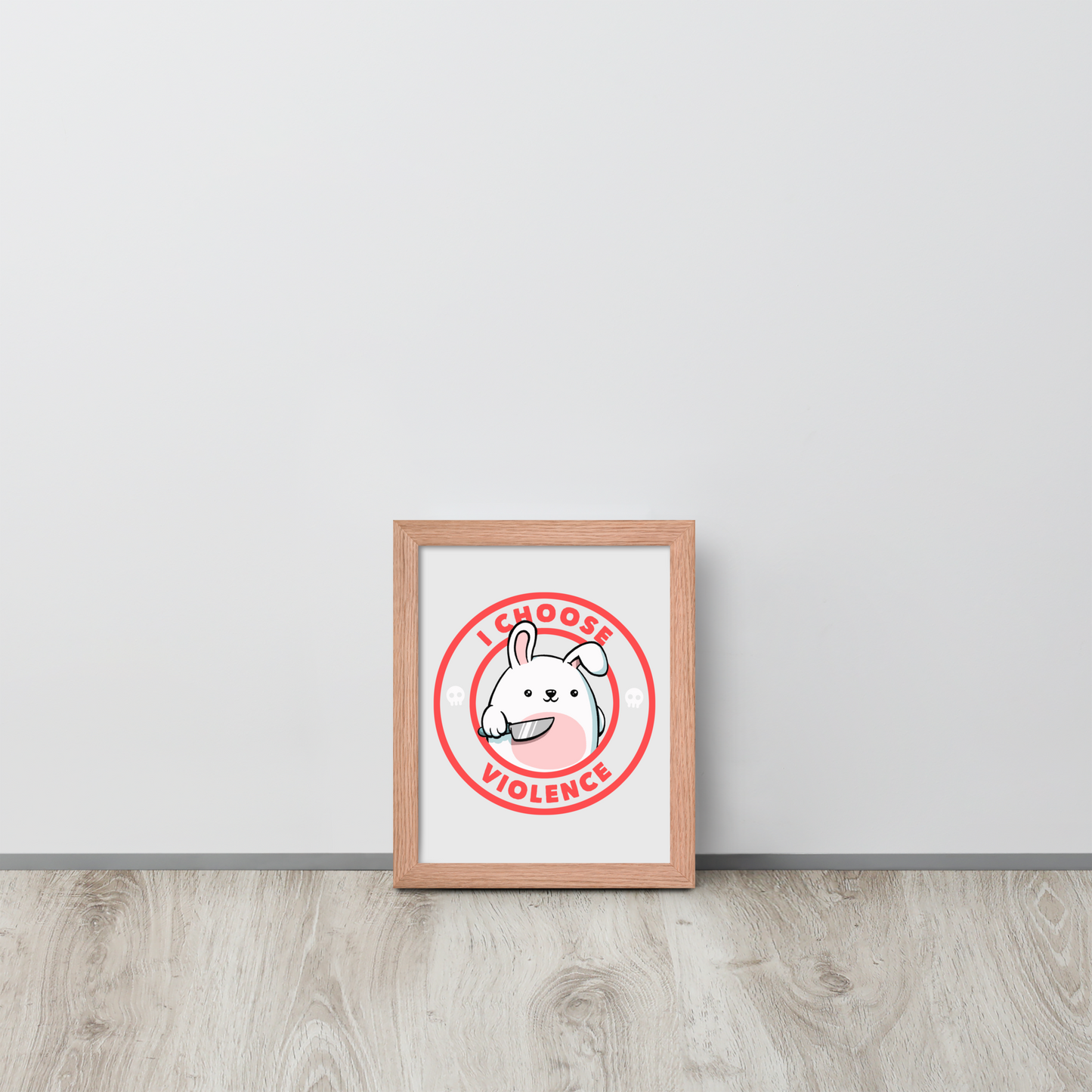 A cute white cartoon bunny with a pink belly stands holding a large kitchen knife in one paw. Surrounding the bunny is a red circular border with the words 'I CHOOSE VIOLENCE'. Small skull icons are on either side of the circle. The overall tone is a mix of adorable and ironic humor.