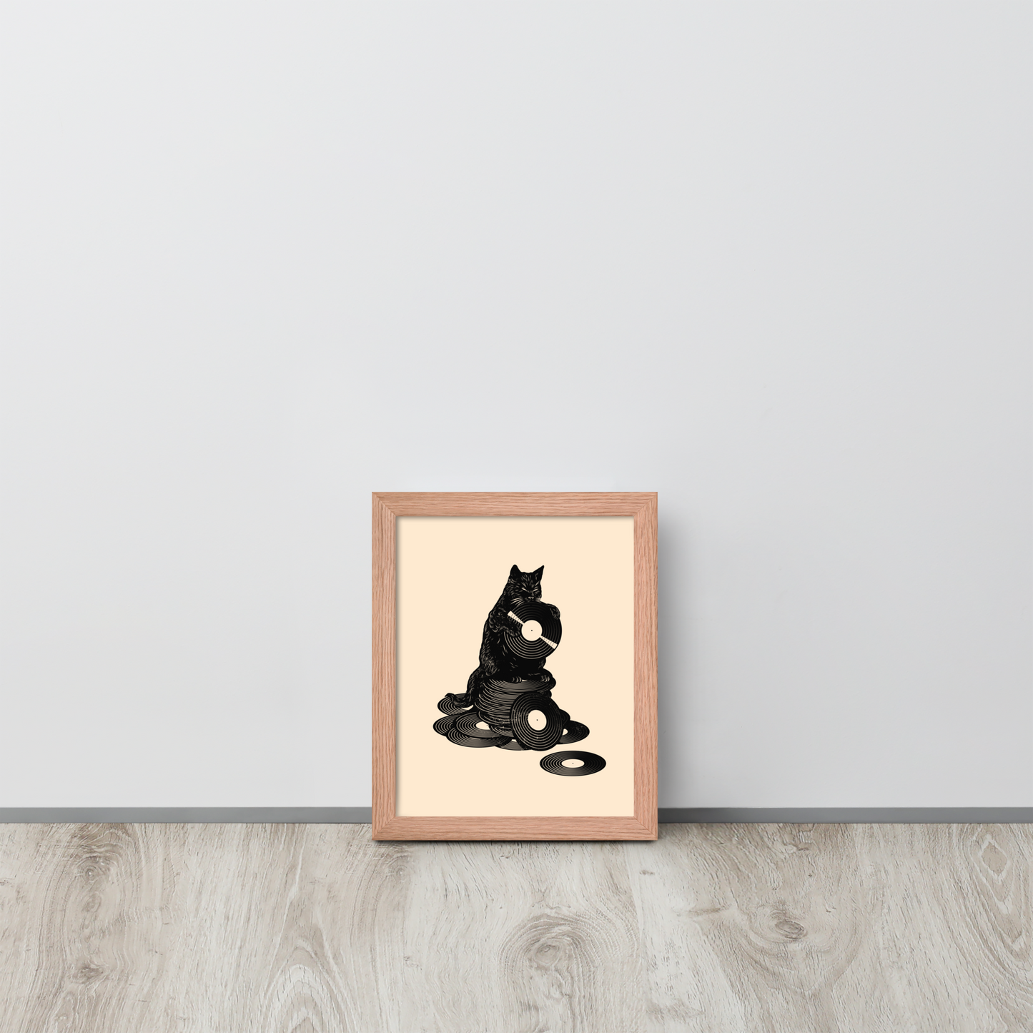 This design features a black cat cozily perched atop a stack of vinyl records, clutching one like it’s pure gold. It’s a tribute to analog lovers, feline charm, and the timeless joy of spinning a record. Perfect for music collectors, cat enthusiasts, and anyone with a nostalgic soul.
