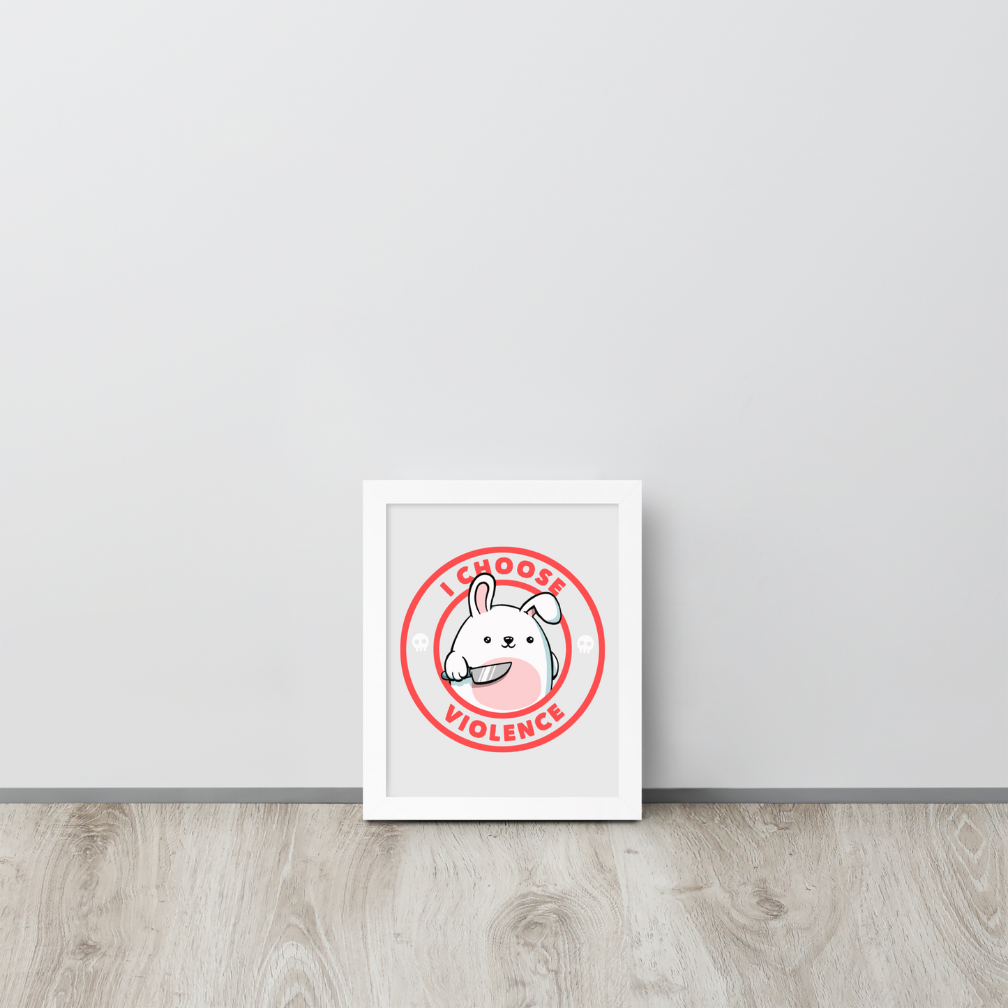 A cute white cartoon bunny with a pink belly stands holding a large kitchen knife in one paw. Surrounding the bunny is a red circular border with the words 'I CHOOSE VIOLENCE'. Small skull icons are on either side of the circle. The overall tone is a mix of adorable and ironic humor.