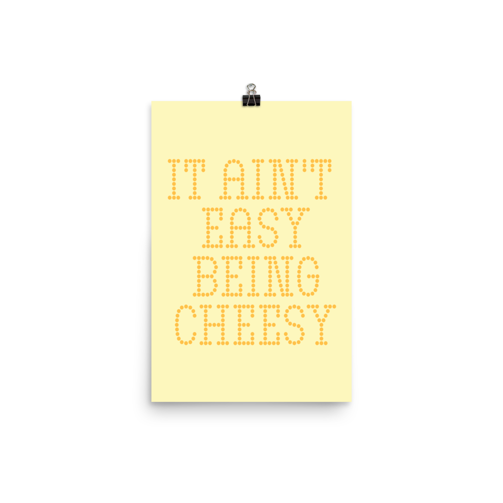 Bold dotted typography spells out ‘It Ain’t Easy Being Cheesy’ in a playful retro style on a yellow background. This funny design mixes wordplay with foodie humor, perfect for pun lovers, cheese fans, retro humor enthusiasts, and anyone who embraces the cringe with pride. A great quirky gift for cheese lovers and humor fans alike.