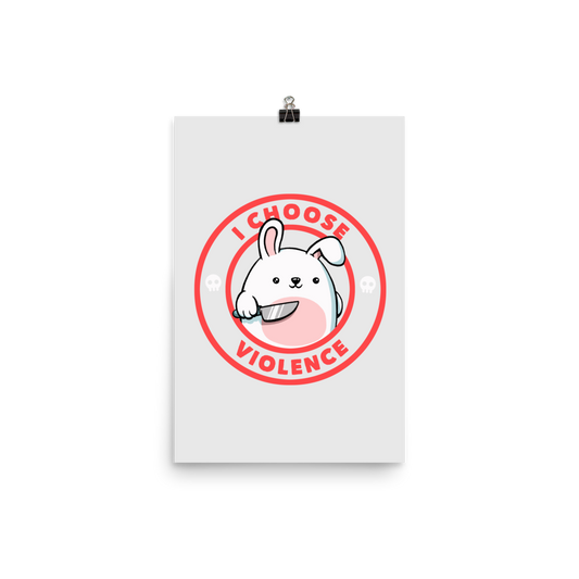 A cute white cartoon bunny with a pink belly stands holding a large kitchen knife in one paw. Surrounding the bunny is a red circular border with the words 'I CHOOSE VIOLENCE'. Small skull icons are on either side of the circle. The overall tone is a mix of adorable and ironic humor.