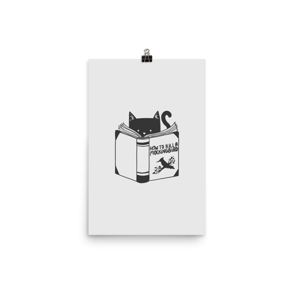 A black and white illustration features a cat peeking over an open book titled 'How to Kill a Mockingbird,' playfully altering the classic novel's title. The cat has a heart-shaped nose and simple, cute facial features. The design is whimsical and ironic, combining classic literature with a humorous twist.