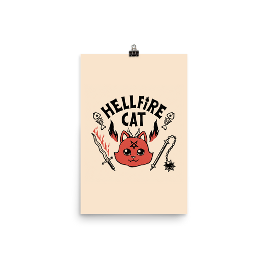 Vintage-style illustration of a cute red devil cat with small horns and a pentagram on its forehead, surrounded by flames, weapons, fish skeletons, and the bold phrase “Hellfire Cat” in a playful gothic design.