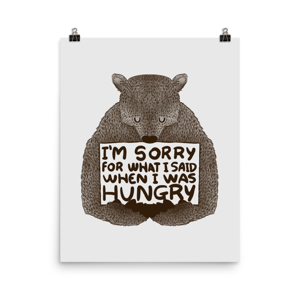 The image shows a humorous, detailed illustration of a bear, drawn in a hand-drawn style, holding a sign that reads 'I'm sorry for what I said when I was hungry.' The bear appears to be apologizing in a comical, endearing manner, making it a relatable and light-hearted design.
