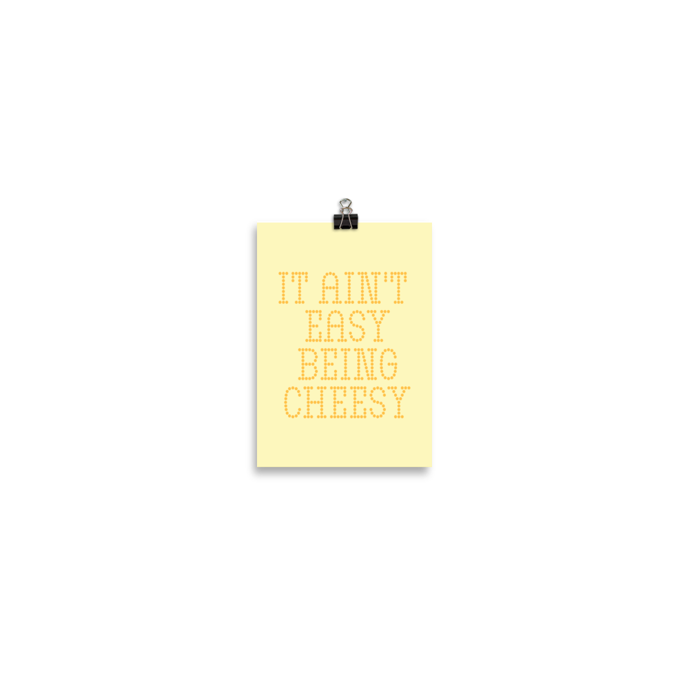 Bold dotted typography spells out ‘It Ain’t Easy Being Cheesy’ in a playful retro style on a yellow background. This funny design mixes wordplay with foodie humor, perfect for pun lovers, cheese fans, retro humor enthusiasts, and anyone who embraces the cringe with pride. A great quirky gift for cheese lovers and humor fans alike.