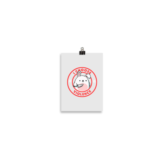 A cute white cartoon bunny with a pink belly stands holding a large kitchen knife in one paw. Surrounding the bunny is a red circular border with the words 'I CHOOSE VIOLENCE'. Small skull icons are on either side of the circle. The overall tone is a mix of adorable and ironic humor.