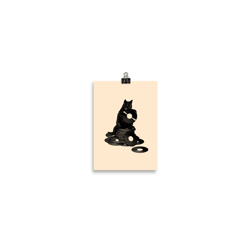 This design features a black cat cozily perched atop a stack of vinyl records, clutching one like it’s pure gold. It’s a tribute to analog lovers, feline charm, and the timeless joy of spinning a record. Perfect for music collectors, cat enthusiasts, and anyone with a nostalgic soul.