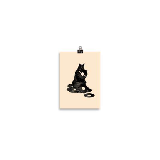 This design features a black cat cozily perched atop a stack of vinyl records, clutching one like it’s pure gold. It’s a tribute to analog lovers, feline charm, and the timeless joy of spinning a record. Perfect for music collectors, cat enthusiasts, and anyone with a nostalgic soul.