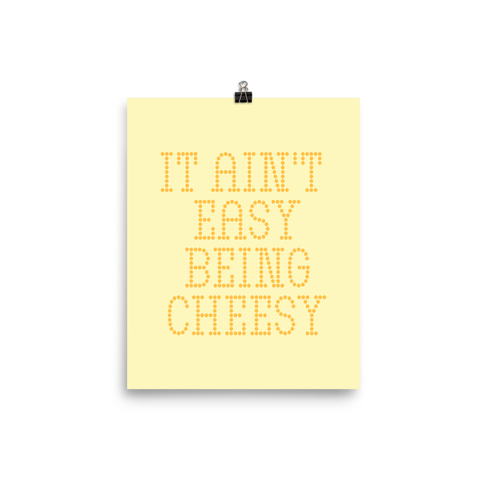 Bold dotted typography spells out ‘It Ain’t Easy Being Cheesy’ in a playful retro style on a yellow background. This funny design mixes wordplay with foodie humor, perfect for pun lovers, cheese fans, retro humor enthusiasts, and anyone who embraces the cringe with pride. A great quirky gift for cheese lovers and humor fans alike.