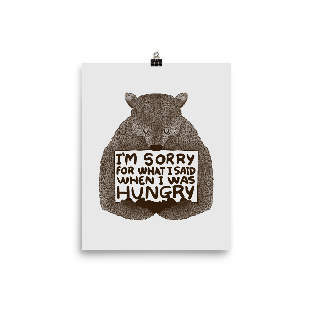 The image shows a humorous, detailed illustration of a bear, drawn in a hand-drawn style, holding a sign that reads 'I'm sorry for what I said when I was hungry.' The bear appears to be apologizing in a comical, endearing manner, making it a relatable and light-hearted design.