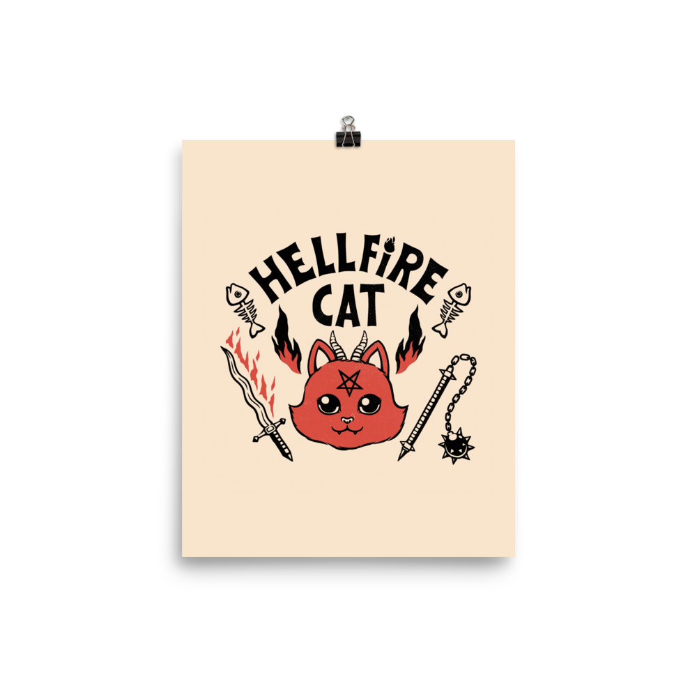Vintage-style illustration of a cute red devil cat with small horns and a pentagram on its forehead, surrounded by flames, weapons, fish skeletons, and the bold phrase “Hellfire Cat” in a playful gothic design.