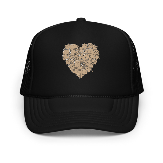 The image showcases an anatomical heart shape filled with numerous small, simple, and cute cartoon-like cat illustrations in a light brown tone. The overall style is whimsical and playful, combining elements of illustration and pop culture art.