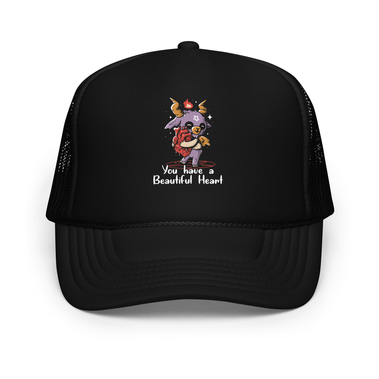 The design features a cute, cartoonish, anthropomorphic goat with big horns and a flame above its head, standing on a red pentagram. The goat has a star on its forehead and is hugging a large, anatomically correct human heart. The text below reads, 'You have a Beautiful Heart'. The image combines elements of occult symbolism with a playful, endearing aesthetic.