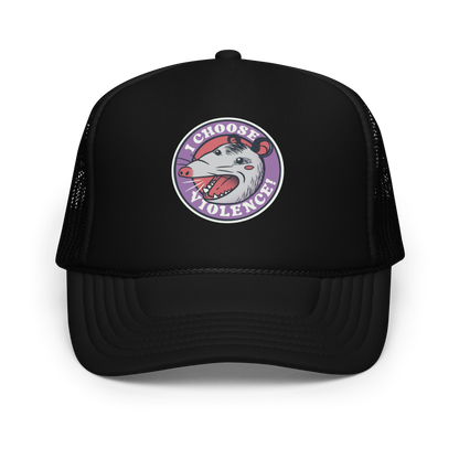 A circular design featuring an opossum with an open mouth showing sharp teeth, set against a red and purple background. Surrounding the animal, the text reads 'I Choose Violence!' in bold, white letters. The opossum has a somewhat comical yet aggressive expression. The design has an edgy, cartoon-like style, suitable for various products like t-shirts and stickers.