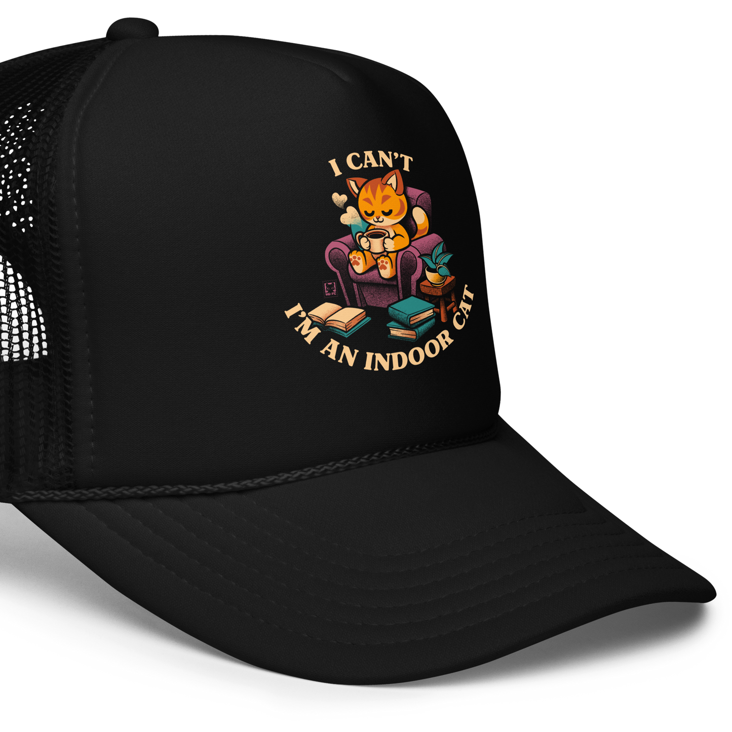 This cozy design features a contented orange cat sipping coffee in a comfy chair, surrounded by books and plants. The following message encircles the design: I CAN'T I'M AN INDOOR CAT.