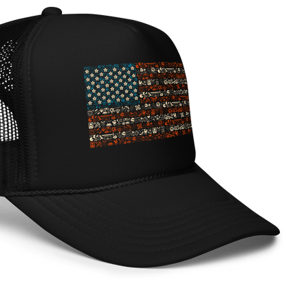 American flag illustration made entirely of retro video game icons, controllers, characters, and symbols in blue, red, and beige, arranged to form the stars and stripes.