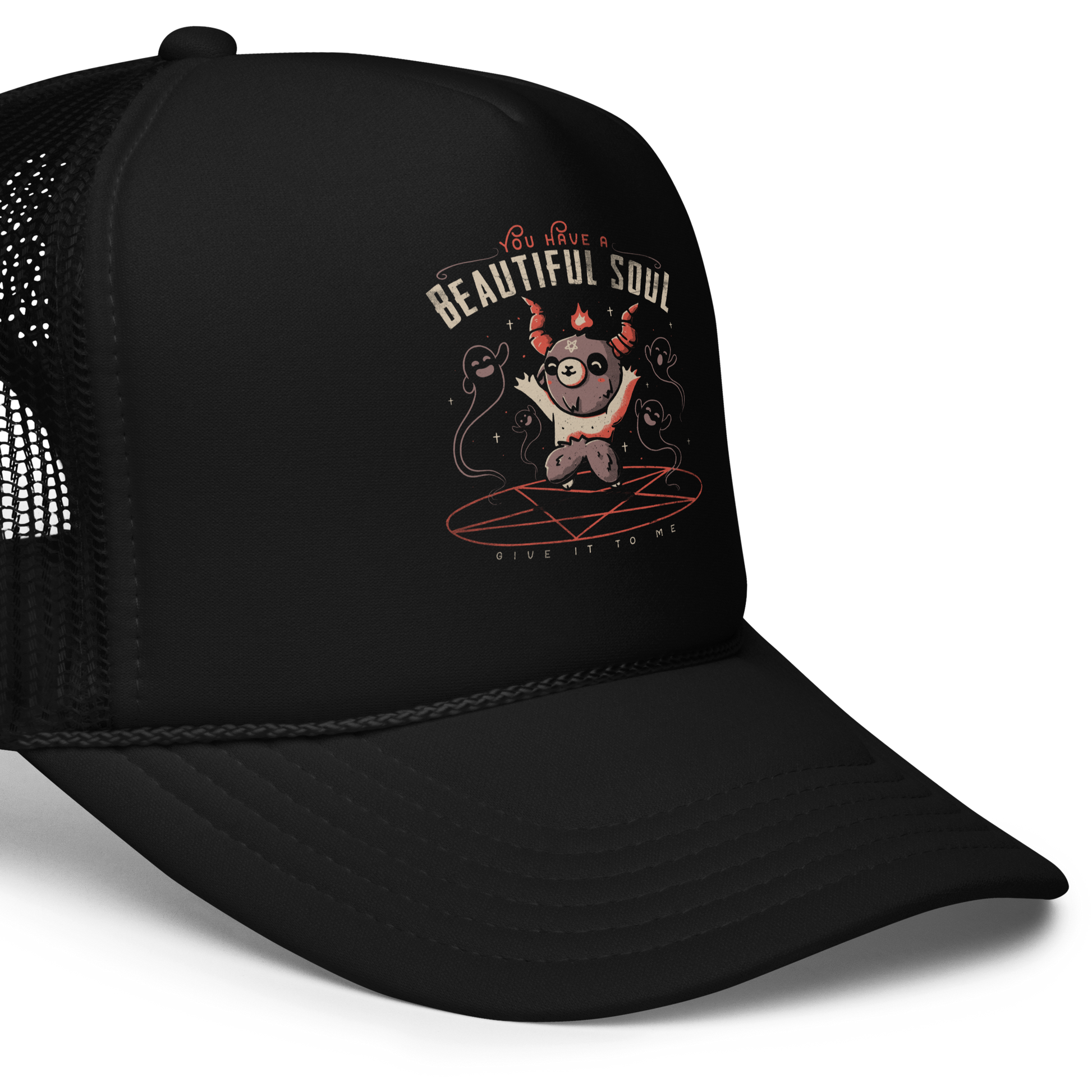 This design features a cute, cartoonish character with horns and a pentagram on its forehead, standing on a red circle with ghost-like figures surrounding it. Above the character, the text reads 'You have a beautiful soul,' and below, 'Give it to me.' The design contrasts dark and cute imagery with playful lettering.