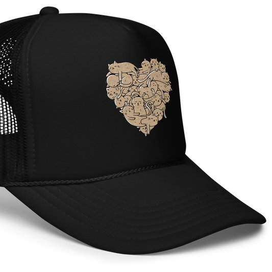 The image showcases an anatomical heart shape filled with numerous small, simple, and cute cartoon-like cat illustrations in a light brown tone. The overall style is whimsical and playful, combining elements of illustration and pop culture art.