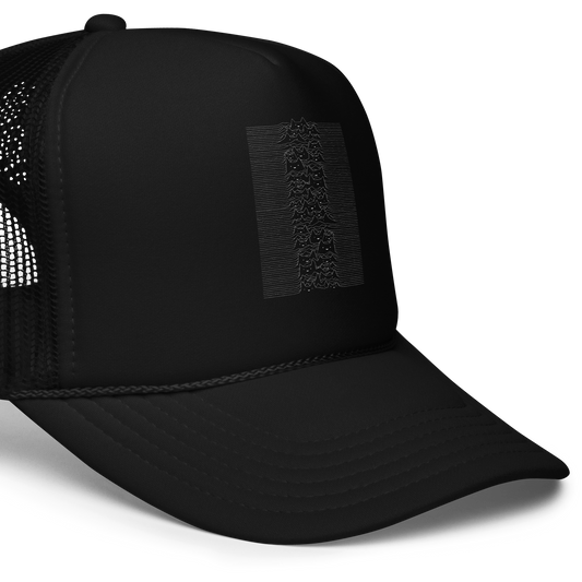 The drawing is a series of continuous wavy lines forming a pattern reminiscent of sound waves or topographic maps, but with an unexpected twist: the lines create the shapes of numerous cat faces stacked vertically. Each cat has simple, expressive features with pointed ears, adding a whimsical element to the otherwise structured pattern.