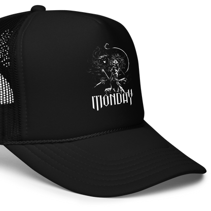 A white fantasy-style illustration showing a wizard standing on a rock, wielding a staff and sword, casting a spell toward a swirling dark, smoky monster with glowing eyes and mouth. The word “MONDAY” appears in large, bold, gothic letters at the bottom, symbolizing the wizard battling the chaos of Monday.