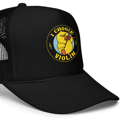 The design features a cute yellow duckling playing a violin with eyes closed in bliss. It is encircled by the phrase 'I Choose Violin' with musical notes on either side. The style is playful and cartoony, giving a warm, humorous vibe.