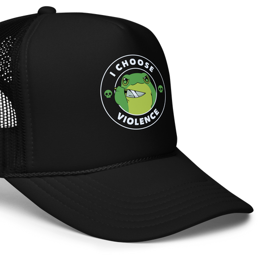 A charming, cartoon-style green frog holds a knife in its hand with a playful yet fierce expression. Encircled by bold text, 'I CHOOSE VIOLENCE,' the design mixes humor with an edge. Two small skulls flank the frog, adding a quirky, rebellious touch to the image. The overall effect balances cuteness and irony in a memorable way.
