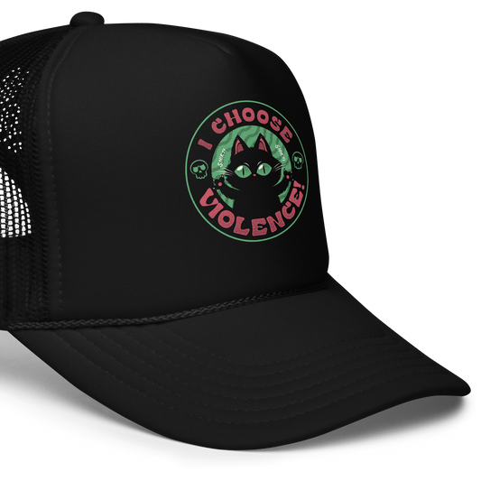 The image features a black cartoon-like cat with large, bright eyes and pointed ears, with a defiant look on its face. The cat is centered within a circular border. Surrounding the cat, the text reads 'I CHOOSE VIOLENCE!' in bold, playful font. There are also small skull illustrations flanking the cat on either side, adding a dark yet humorous tone to the design.