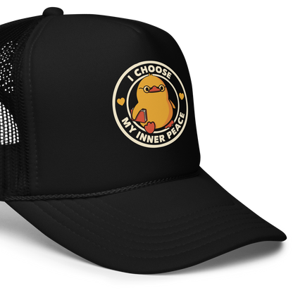 A cute yellow bird with a small tuft of feathers on its head is wearing round glasses and holding a red book. The bird has a determined expression. The image is encircled by the phrase 'I CHOOSE MY INNER PEACE' with two small hearts on each side.