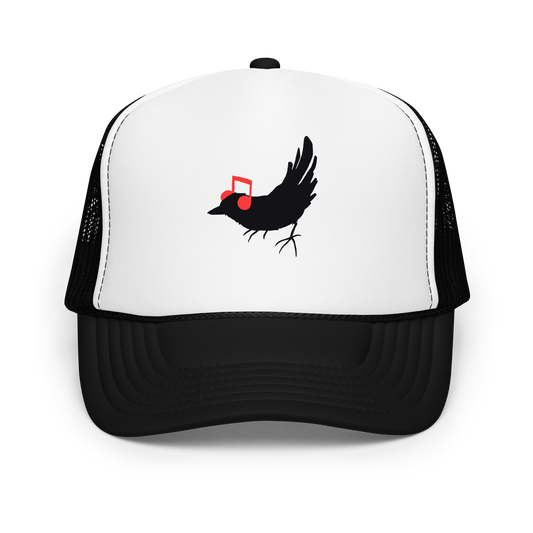 The drawing is a black silhouette of a bird in profile, standing on the ground, with bright red musical notes positioned like headphones over its ears, creating a whimsical and playful contrast. The drawing is simple, using solid colors and minimal details, giving it a modern and fun feel suitable for various merchandise like t-shirts, stickers, coffee cups, and skateboards.