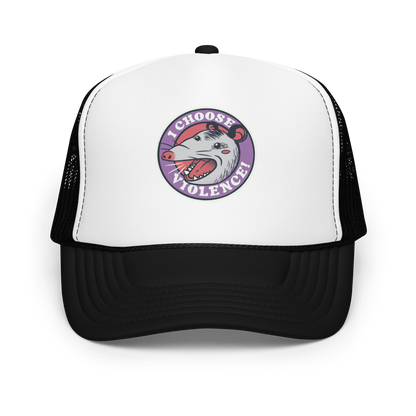 A circular design featuring an opossum with an open mouth showing sharp teeth, set against a red and purple background. Surrounding the animal, the text reads 'I Choose Violence!' in bold, white letters. The opossum has a somewhat comical yet aggressive expression. The design has an edgy, cartoon-like style, suitable for various products like t-shirts and stickers.