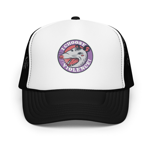 A circular design featuring an opossum with an open mouth showing sharp teeth, set against a red and purple background. Surrounding the animal, the text reads 'I Choose Violence!' in bold, white letters. The opossum has a somewhat comical yet aggressive expression. The design has an edgy, cartoon-like style, suitable for various products like t-shirts and stickers.