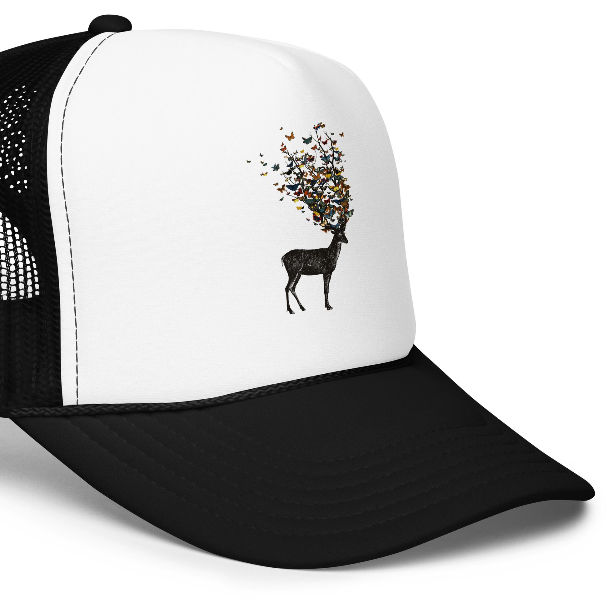 The image depicts a dark, silhouetted deer standing on a neutral background. Instead of branches, its antlers transform into a swirling cloud of vibrant, colorful butterflies that extend upwards and outward. The mix of organic and ethereal elements creates a captivating and whimsical visual contrast.