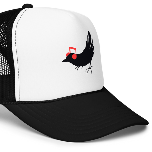 The drawing is a black silhouette of a bird in profile, standing on the ground, with bright red musical notes positioned like headphones over its ears, creating a whimsical and playful contrast. The drawing is simple, using solid colors and minimal details, giving it a modern and fun feel suitable for various merchandise like t-shirts, stickers, coffee cups, and skateboards.