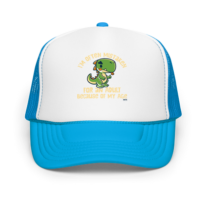 Cute cartoon dinosaur standing with a funny expression, accompanied by the humorous phrase “I’m Often Mistaken for an Adult Because of My Age” in bold distressed lettering.
