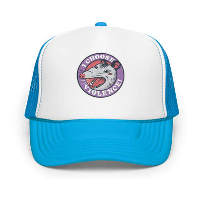 A circular design featuring an opossum with an open mouth showing sharp teeth, set against a red and purple background. Surrounding the animal, the text reads 'I Choose Violence!' in bold, white letters. The opossum has a somewhat comical yet aggressive expression. The design has an edgy, cartoon-like style, suitable for various products like t-shirts and stickers.