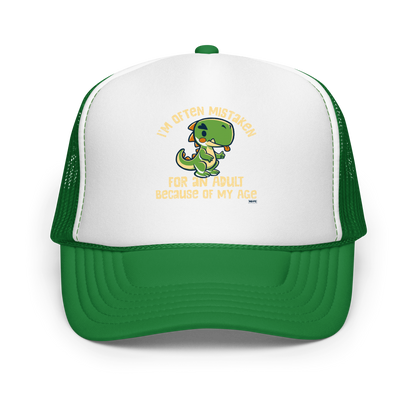 Cute cartoon dinosaur standing with a funny expression, accompanied by the humorous phrase “I’m Often Mistaken for an Adult Because of My Age” in bold distressed lettering.