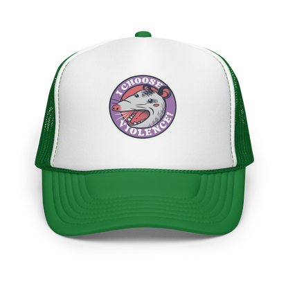 A circular design featuring an opossum with an open mouth showing sharp teeth, set against a red and purple background. Surrounding the animal, the text reads 'I Choose Violence!' in bold, white letters. The opossum has a somewhat comical yet aggressive expression. The design has an edgy, cartoon-like style, suitable for various products like t-shirts and stickers.