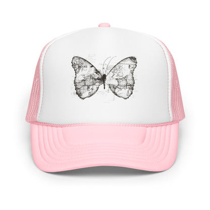 The image features a black and white butterfly where the wings are created using ancient world map designs. The maps overlay in intricate detail, blending geographical elements with the organic shape of the butterfly. Surrounding the butterfly are faint outlines of text and additional geographic features, creating a vintage and exploratory vibe.