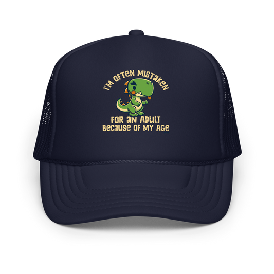 Cute cartoon dinosaur standing with a funny expression, accompanied by the humorous phrase “I’m Often Mistaken for an Adult Because of My Age” in bold distressed lettering.