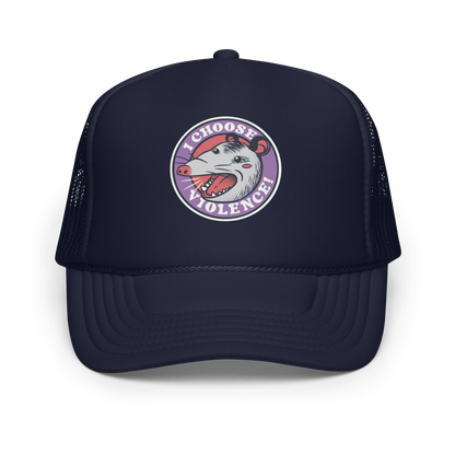 A circular design featuring an opossum with an open mouth showing sharp teeth, set against a red and purple background. Surrounding the animal, the text reads 'I Choose Violence!' in bold, white letters. The opossum has a somewhat comical yet aggressive expression. The design has an edgy, cartoon-like style, suitable for various products like t-shirts and stickers.
