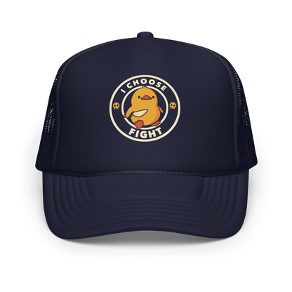 The image displays a cute, cartoon-style yellow duck character holding a knife with a determined expression. The duck is centered inside a circular design with the text 'I CHOOSE FIGHT' around it. Two small skulls flanking the duck add a humorous, combative touch to the design.