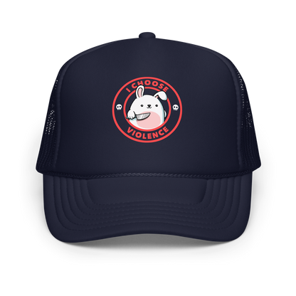A cute white cartoon bunny with a pink belly stands holding a large kitchen knife in one paw. Surrounding the bunny is a red circular border with the words 'I CHOOSE VIOLENCE'. Small skull icons are on either side of the circle. The overall tone is a mix of adorable and ironic humor.