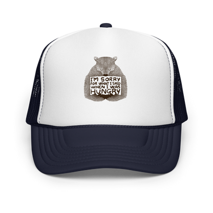 The image shows a humorous, detailed illustration of a bear, drawn in a hand-drawn style, holding a sign that reads 'I'm sorry for what I said when I was hungry.' The bear appears to be apologizing in a comical, endearing manner, making it a relatable and light-hearted design.