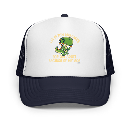 Cute cartoon dinosaur standing with a funny expression, accompanied by the humorous phrase “I’m Often Mistaken for an Adult Because of My Age” in bold distressed lettering.