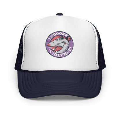 A circular design featuring an opossum with an open mouth showing sharp teeth, set against a red and purple background. Surrounding the animal, the text reads 'I Choose Violence!' in bold, white letters. The opossum has a somewhat comical yet aggressive expression. The design has an edgy, cartoon-like style, suitable for various products like t-shirts and stickers.