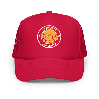 A cute yellow cartoon dog holds a small knife, surrounded by a circular logo that reads 'I Choose Violence'. The dog's expression is serious, yet the overall style is playful and cute. Two small skull icons are on either side, adding an ironic tone to the cheerful design.